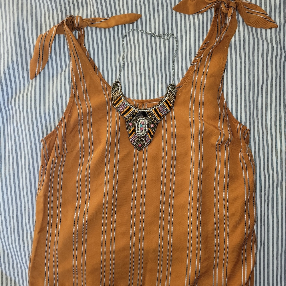 A New Day orange tank